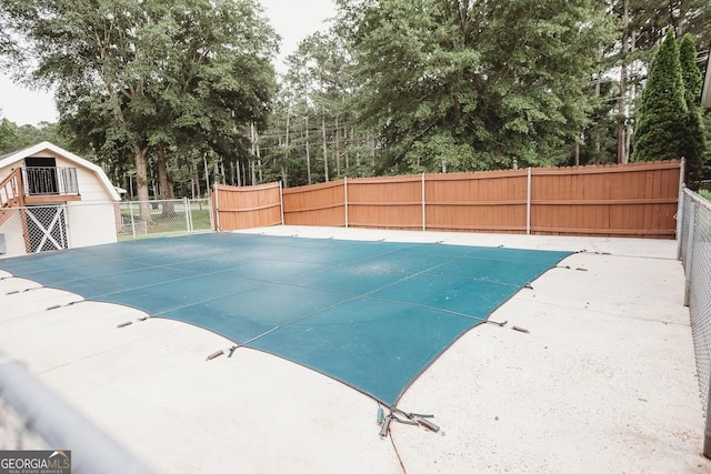 500 Holmes St, Barnesville, GA 30204 - view of pool featuring view of wooded area
