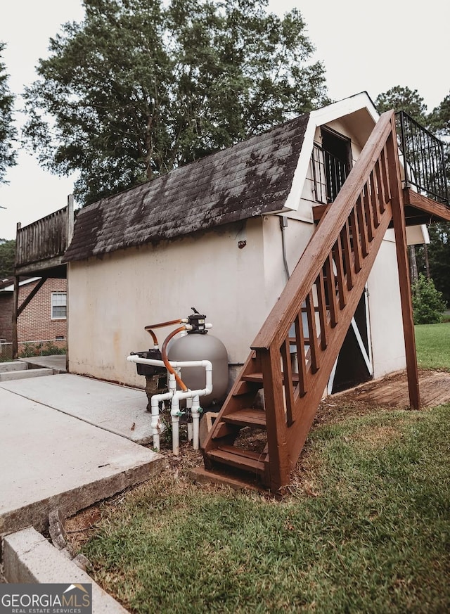 500 Holmes St, Barnesville, GA 30204 - rear view of property featuring stairs, stucco siding, a shingled roof, and a patio area