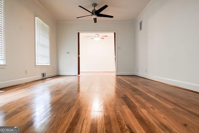 500 Holmes St, Barnesville, GA 30204 - spare room featuring crown molding, a ceiling fan, and wood finished floors