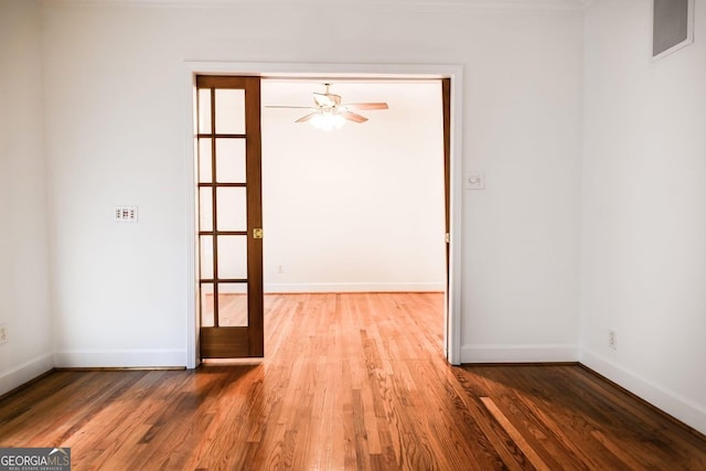 500 Holmes St, Barnesville, GA 30204 - empty room with wood finished floors and ceiling fan