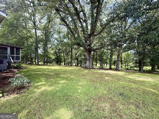 314 Elbert Jackson Rd, Forsyth, GA 31029 - view of grassy yard with a sunroom