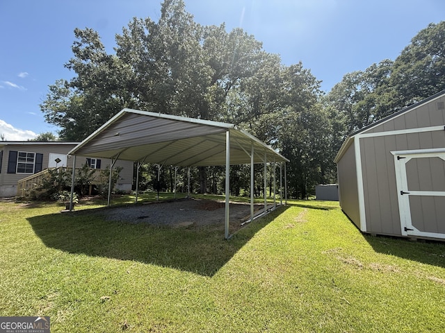 314 Elbert Jackson Rd, Forsyth, GA 31029 - view of grassy yard with a storage unit, a carport, and driveway