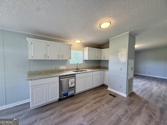 314 Elbert Jackson Rd, Forsyth, GA 31029 - kitchen with dishwasher, white cabinets, dark wood-style floors, a textured ceiling, and ornamental molding
