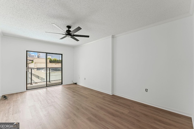 1280 W Peachtree St NW Unit 808, Atlanta, GA 30309 - unfurnished room featuring a textured ceiling, wood finished floors, ornamental molding, and a ceiling fan