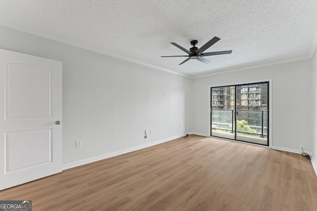 1280 W Peachtree St NW Unit 808, Atlanta, GA 30309 - empty room featuring light wood finished floors, a textured ceiling, a ceiling fan, and crown molding