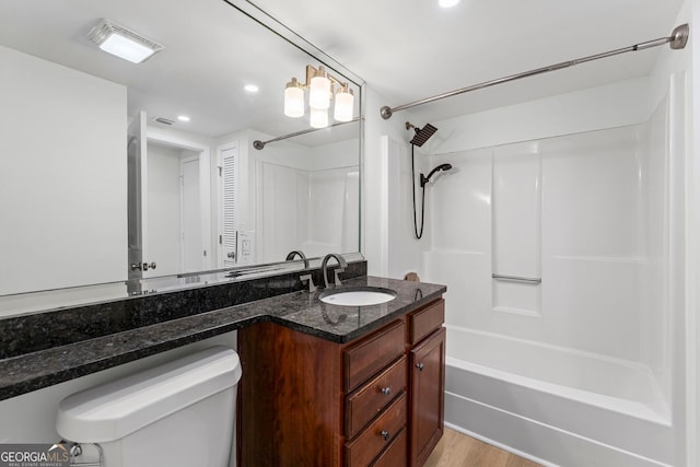 1280 W Peachtree St NW Unit 808, Atlanta, GA 30309 - full bath featuring washtub / shower combination, vanity, recessed lighting, and wood finished floors