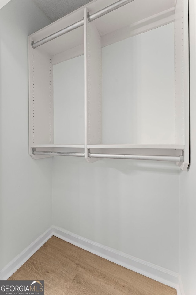 1280 W Peachtree St NW Unit 808, Atlanta, GA 30309 - spacious closet with wood finished floors