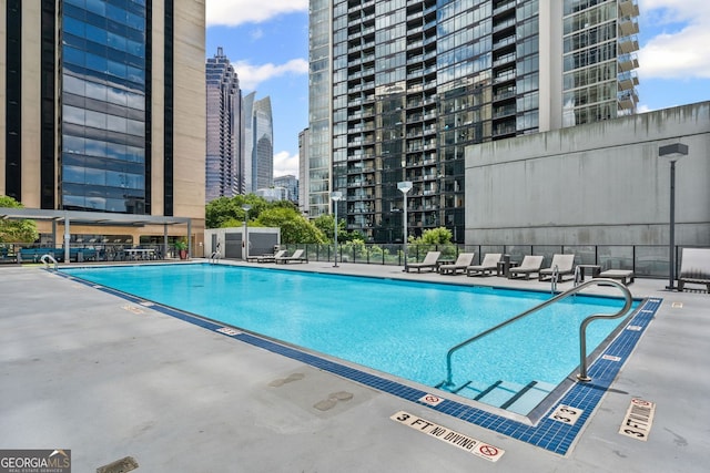 1280 W Peachtree St NW Unit 808, Atlanta, GA 30309 - community pool featuring a skyline view and a patio area