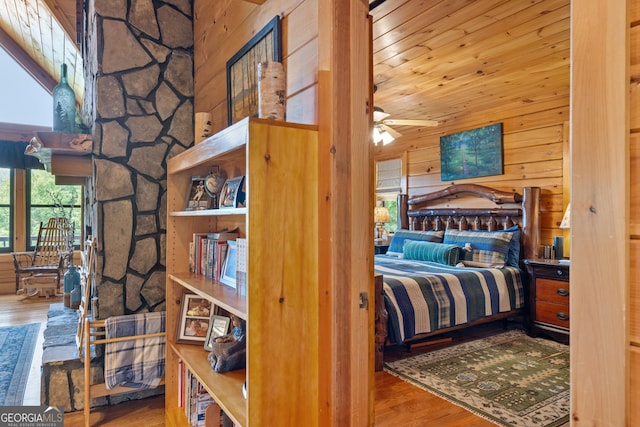 115 Wildcat Run, Suches, GA 30572 - bedroom featuring wood finished floors, wood walls, and wooden ceiling