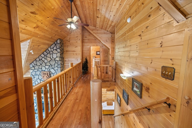 115 Wildcat Run, Suches, GA 30572 - hallway featuring an upstairs landing, wood walls, lofted ceiling, light wood finished floors, and wood ceiling
