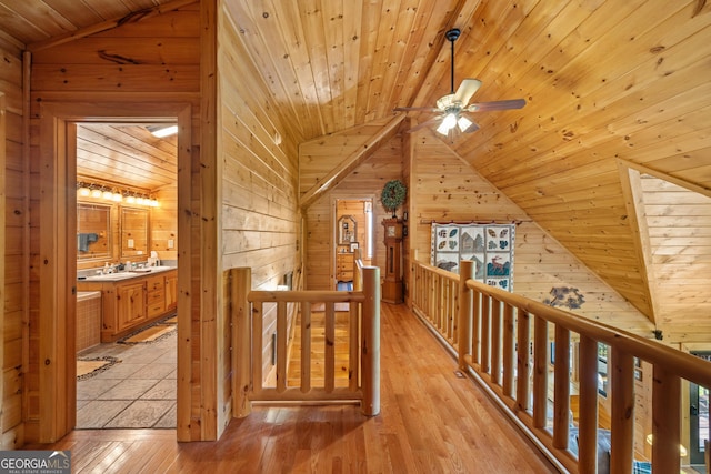 115 Wildcat Run, Suches, GA 30572 - corridor with lofted ceiling, an upstairs landing, wooden walls, wood ceiling, and light wood-style flooring