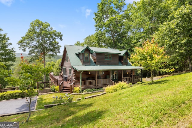 115 Wildcat Run, Suches, GA 30572 - rear view of house with log siding, a lawn, and covered porch
