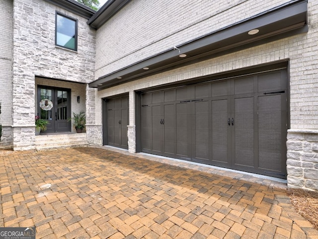 913 Sunny Meadows Ln, Marietta, GA 30062 - garage featuring decorative driveway and french doors