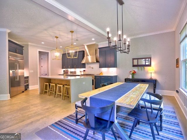 913 Sunny Meadows Ln, Marietta, GA 30062 - dining space with a textured ceiling, a chandelier, crown molding, recessed lighting, and light wood finished floors