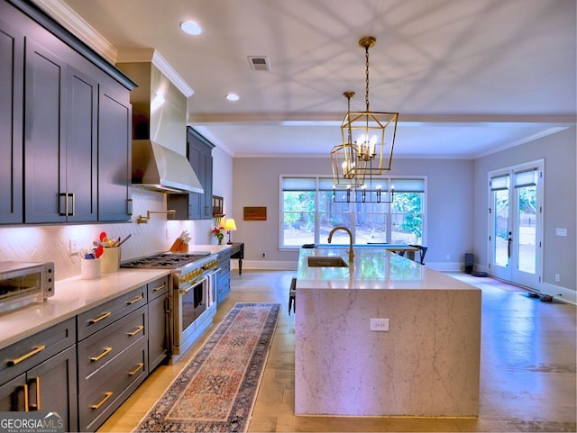 913 Sunny Meadows Ln, Marietta, GA 30062 - kitchen featuring wall chimney range hood, high end stainless steel range oven, ornamental molding, light wood-type flooring, and recessed lighting