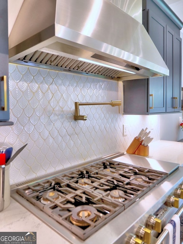 913 Sunny Meadows Ln, Marietta, GA 30062 - kitchen with wall chimney exhaust hood, stovetop, and light countertops