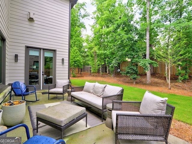 913 Sunny Meadows Ln, Marietta, GA 30062 - fenced backyard with an outdoor hangout area, french doors, and a patio