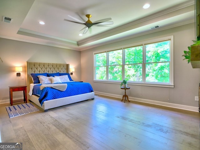 913 Sunny Meadows Ln, Marietta, GA 30062 - bedroom with multiple windows, a tray ceiling, ornamental molding, hardwood / wood-style floors, and recessed lighting