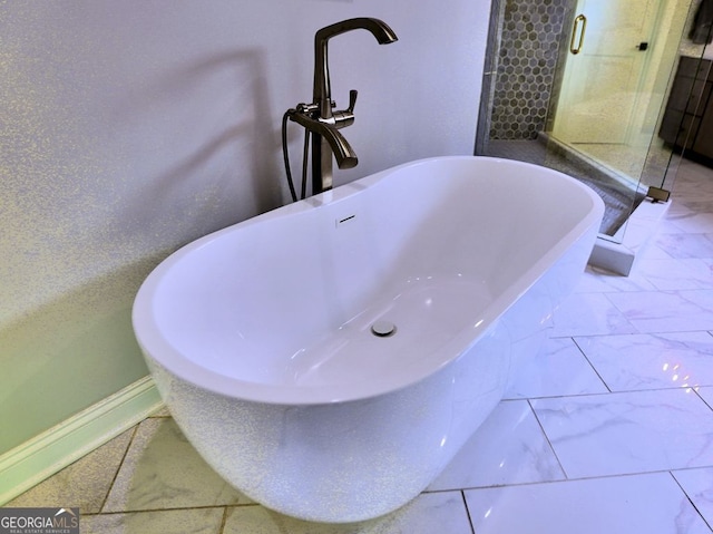 913 Sunny Meadows Ln, Marietta, GA 30062 - bathroom view of a stall shower and a freestanding tub