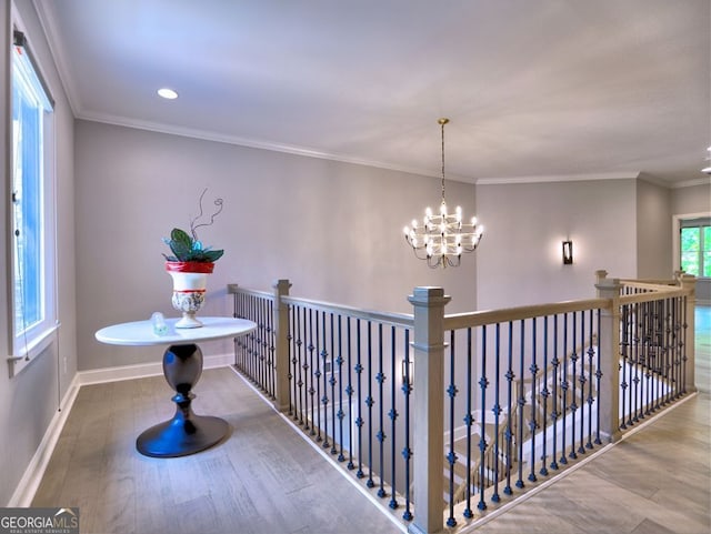 913 Sunny Meadows Ln, Marietta, GA 30062 - hallway featuring a chandelier, wood finished floors, recessed lighting, crown molding, and an upstairs landing