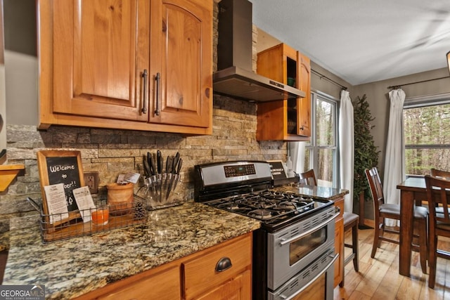 230 Grove Ln Unit 3642, Ellijay, GA 30540 - kitchen with double oven range, wall chimney exhaust hood, backsplash, stone countertops, and light wood-type flooring
