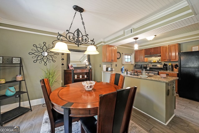1313 Old Countryside Cir, Stone Mountain, GA 30083 - dining space featuring crown molding and wood finished floors