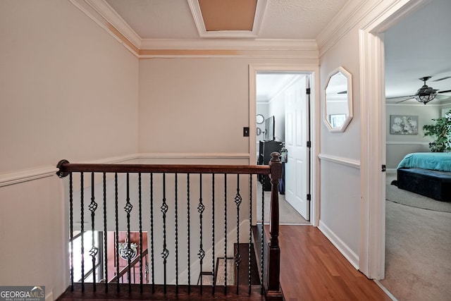 1313 Old Countryside Cir, Stone Mountain, GA 30083 - hallway with wood finished floors, an upstairs landing, and ornamental molding