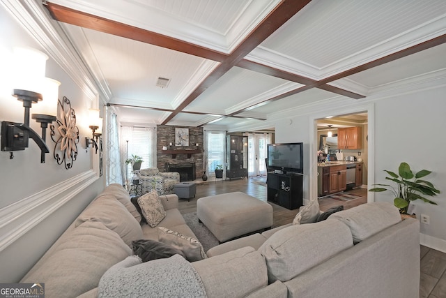 1313 Old Countryside Cir, Stone Mountain, GA 30083 - living room with coffered ceiling, dark wood finished floors, a stone fireplace, ornamental molding, and beamed ceiling