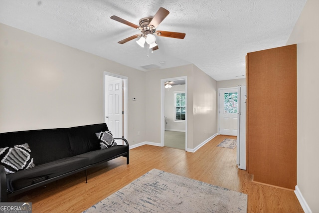 106 Ivy Ct, Lagrange, GA 30241 - living room with a ceiling fan, light wood-style floors, and a textured ceiling