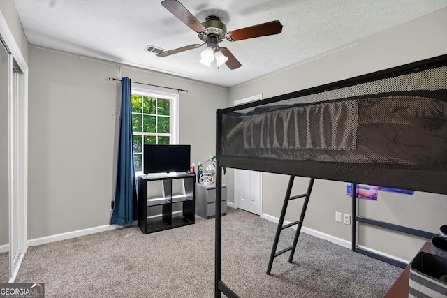 106 Ivy Ct, Lagrange, GA 30241 - carpeted bedroom with a ceiling fan and a textured ceiling