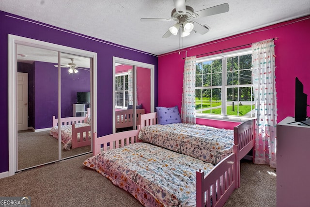 106 Ivy Ct, Lagrange, GA 30241 - bedroom featuring carpet, a textured ceiling, two closets, and ceiling fan