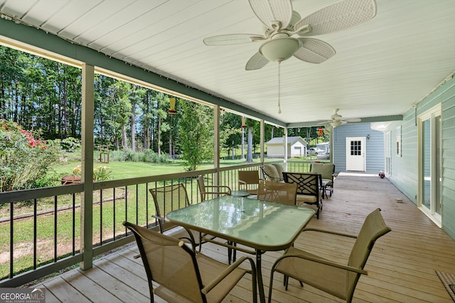 106 Ivy Ct, Lagrange, GA 30241 - wooden terrace featuring outdoor dining area, a yard, and a ceiling fan