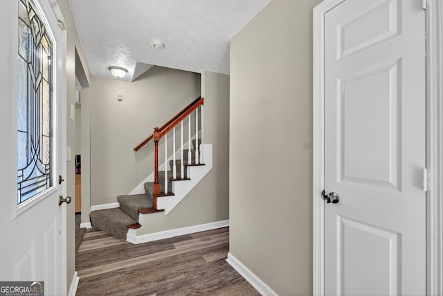 106 Ivy Ct, Lagrange, GA 30241 - entryway with wood finished floors, stairway, and a textured ceiling