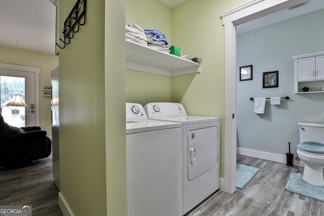 682 Tanglewood Ln, Ellijay, GA 30540 - laundry area with washer and dryer and wood finished floors