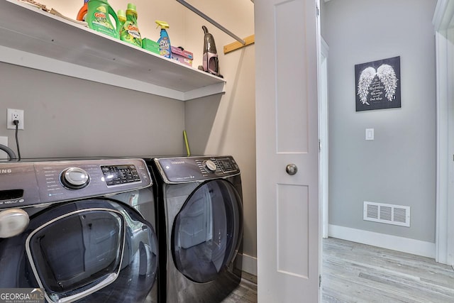 682 Tanglewood Ln, Ellijay, GA 30540 - laundry area featuring washer and clothes dryer and wood finished floors