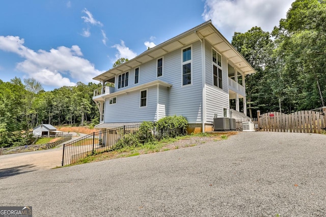 682 Tanglewood Ln, Ellijay, GA 30540 - view of home's exterior with a central AC unit and gravel driveway