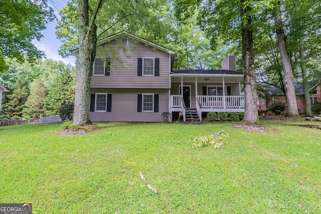 3110 Ashly Cove Ln, Snellville, GA 30078 - tri-level home featuring a chimney and a porch