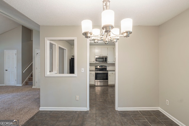 3110 Ashly Cove Ln, Snellville, GA 30078 - unfurnished dining area with a chandelier, stairway, and a textured ceiling
