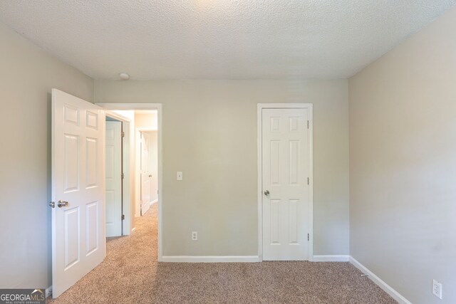 3110 Ashly Cove Ln, Snellville, GA 30078 - unfurnished bedroom with carpet and a textured ceiling