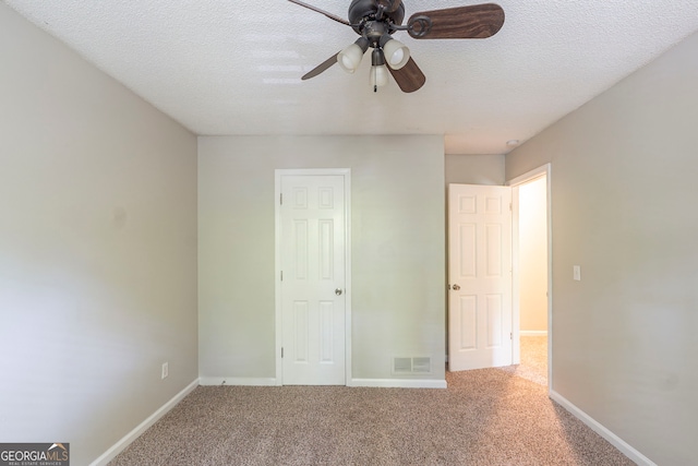 3110 Ashly Cove Ln, Snellville, GA 30078 - unfurnished bedroom with carpet, a textured ceiling, and a ceiling fan
