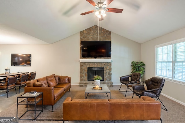 3110 Ashly Cove Ln, Snellville, GA 30078 - living room with a ceiling fan, vaulted ceiling, a stone fireplace, and carpet floors