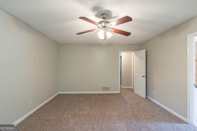 3110 Ashly Cove Ln, Snellville, GA 30078 - unfurnished bedroom featuring carpet, a textured ceiling, and a ceiling fan