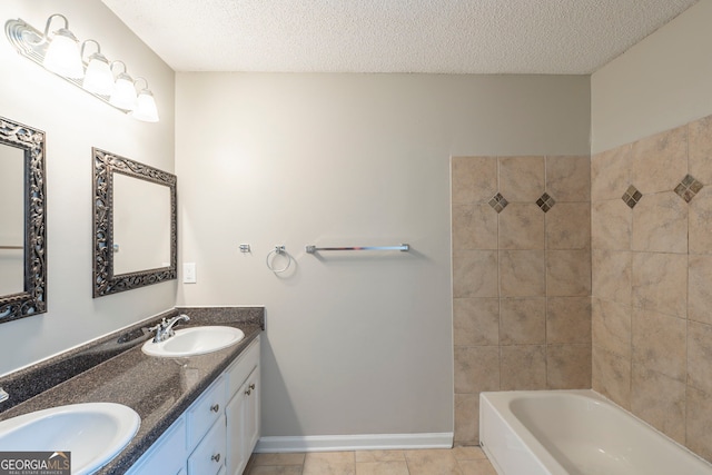 3110 Ashly Cove Ln, Snellville, GA 30078 - bathroom featuring double vanity, tile patterned floors, a textured ceiling, and shower / bath combination