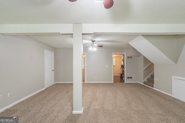 3110 Ashly Cove Ln, Snellville, GA 30078 - below grade area featuring a ceiling fan, carpet, stairs, and a textured ceiling