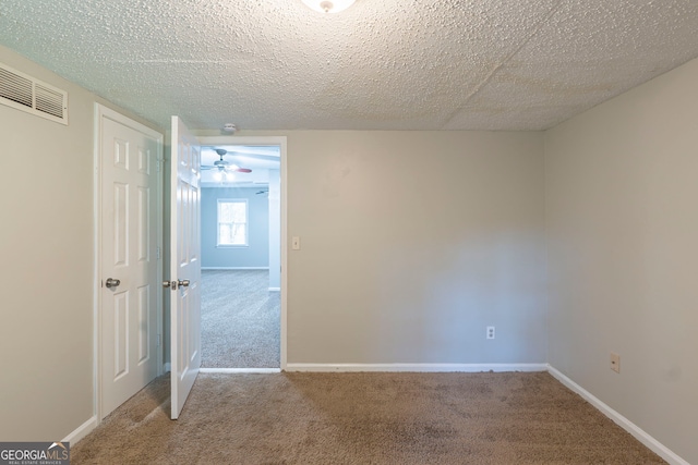 3110 Ashly Cove Ln, Snellville, GA 30078 - carpeted empty room featuring a ceiling fan and a textured ceiling