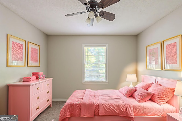 3110 Ashly Cove Ln, Snellville, GA 30078 - bedroom with dark colored carpet, a textured ceiling, and a ceiling fan