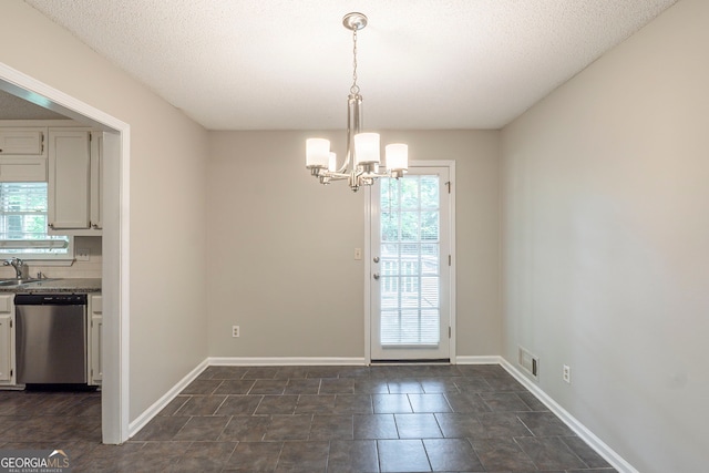 3110 Ashly Cove Ln, Snellville, GA 30078 - unfurnished dining area with a chandelier and a sink