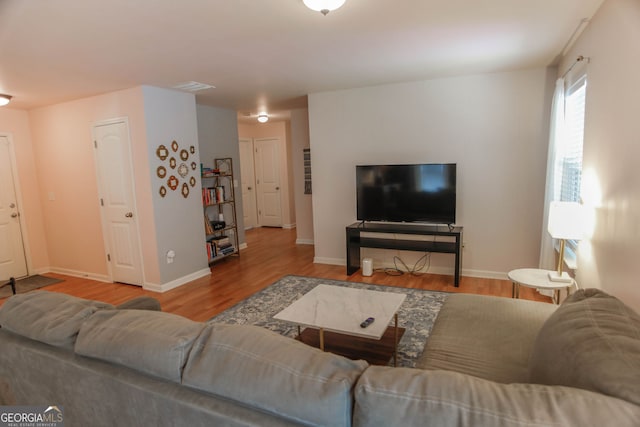 691 Walnut Woods Dr, Braselton, GA 30517 - living room featuring wood finished floors and baseboards