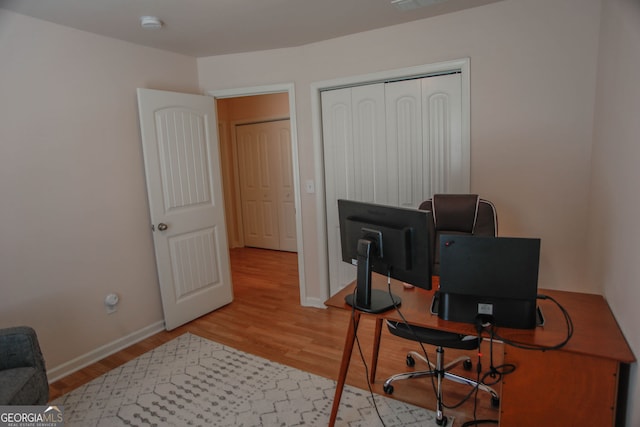 691 Walnut Woods Dr, Braselton, GA 30517 - office area with wood finished floors and baseboards