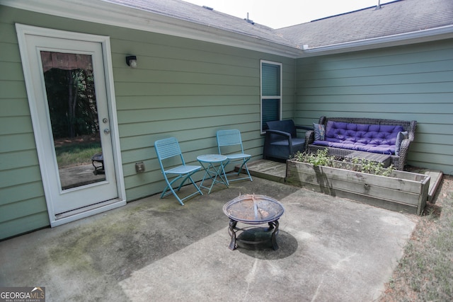 691 Walnut Woods Dr, Braselton, GA 30517 - view of patio / terrace with an outdoor living space with a fire pit